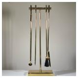 MID-CENTURY MODERN STYLE BRASS FIREPLACE TOOL SET AND STAND | This clear glass cake stand features a