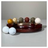 NAVIKA DEVELOPMENT OF THE GOLF BALL HISTORICAL REPLICA DISPLAY | This dark-finished wood display set