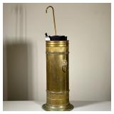 (3pc) BRASS UMBRELLA STAND WITH TWO PARASOLS | Cylindrical brass umbrella stand featuring twin lion 