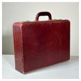 VINTAGE LEATHER ATTACHÉ CASE | Hard-sided attaché case crafted from oxblood leather with tonal stitc