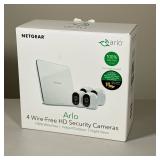 NETGEAR ARLO WIRE-FREE HD SECURITY SYSTEM WITH FOUR CAMERAS | The system includes four white wire-fr