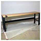INDUSTRIAL BUTCHER BLOCK WORKBENCH WITH VICE | The workbench features a thick butcher block wood top