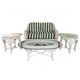 FOUR-PIECE WHITE WICKER PATIO FURNITURE SET WITH GLASS TOPS AND STRIPED CUSHIONS