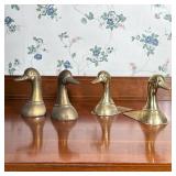 TWO PAIRS OF BRASS DUCK HEAD BOOKENDS