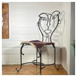 AFTER JOHN RISLEY, WROUGHT IRON ANTHROPOMORPHIC FACE CHAIR