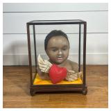 FOLK ART VITRINE DIORAMA WITH ANTIQUE DOLL HEAD & CARVED WINGED HEART