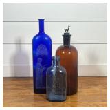 (3pc) VINTAGE DECORATIVE BLUE & BROWN GLASS BOTTLES