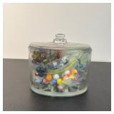 COLLECTION OF ASSORTED GLASS MARBLES IN LIDDED JAR