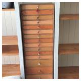 TALL TWENTY-DRAWER WOODEN CABINET WITH CUSTOM BUTTON PULLS