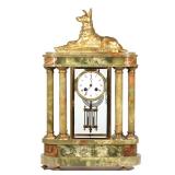 LOT 61 | GREEN ONYX GILT BRONZE MANTEL CLOCK | French, 19th century, the round clock face with Roman