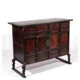 LOT 78 | JAPANESE TANSU CHEST | Having six drawers over double cabinet doors with brass lotus form h