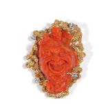 LOT 105 | CARVED CORAL HEAD & DIAMOND 18K GOLD PIN | Designed as a carved coral head of a mystical f