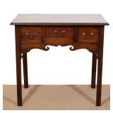 LOT 151 | EARLY 19TH CENTURY GEORGIAN MAHOGANY LOWBOY | Having an over hanging molded top, with 3 co