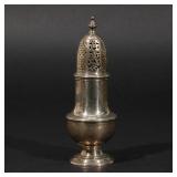 LOT 206 | GEORGE II SILVER SUGAR CASTER | The body with engraved decoration of a man pouring water b