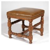 LOT 230 | 18TH CENTURY BAROQUE FOOT STOOL | With worn leather upholstery h. 18 w. 17 d. 7 in.