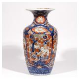 LOT 345 | EDO PERIOD IMARI RIBBED BALUSTER VASE | Late 18th or 19th century, with two landscape rese