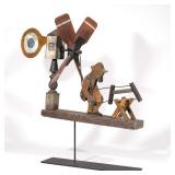 LOT 361 | FOLK ART WHIRLIGIG: MAN SAWING | The four blade propeller on a post connected to a mechani