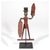 LOT 364 | FOLK ART WHIRLIGIG: MAN IN TOP HAT | A man with a mustache wearing a top hat, with old pai