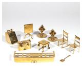 LOT 410 | (10PC) GROUP BRASS MINIATURES | Including a coal scuttle and shovel, a tilt-top tea table,