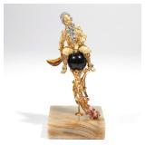 LOT 473 | ITALIAN GEMSTONE & ENAMELED 18K GOLD FIGURE | Figural sculpture of a man with guilloche en