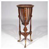 LOT 532 | REGENCY OR REGENCY-STYLE JARDINIERE | Having a round tapering basin of open slats raised o