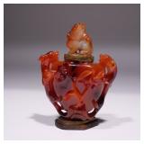 LOT 86 | CHINESE AGATE CARVED VASE & COVER | The vase carved with chilong handles and a foo-dog stan