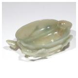 LOT 88 | CHINESE CELADON JADE BRUSH WASHER | In the form of a melon with sprigs of foliage on the ba