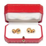 LOT 111 | PAIR CARTIER 18K & SAPPHIRE CUFFLINKS | Designed as two 18k yellow gold graduated ribbed d