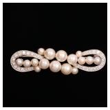 LOT 123 | DAVID WEBB PEARL & DIAMOND PLATINUM BROOCH | Designed as 16 pearls (4.5 - 7.8mm) joining a