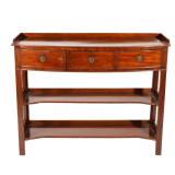 LOT 151 | REGENCY BOWED MAHOGANY SERVER | Having a three quarter gallery, resting on an over-hanging