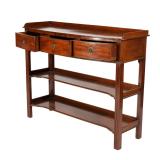 Having a three quarter gallery, resting on an over-hanging top with molded edge, over three cockbead