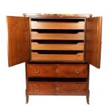 having a pair of cabinet doors revealing four open drawers, over two long drawers, with breche d