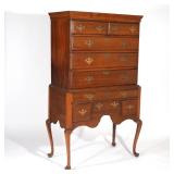 Circa 1780, of two-piece construction, the upper section with two drawers over three full-width draw
