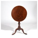 LOT 163 | AMERICAN MAHOGANY TILT TOP CANDLESTAND | Early 19th century, having a round one piece top 