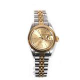  c. 1979, gold dial with baton markers, date window with cyclops, marked "Rolex / Oyster Perpetual /