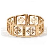 LOT 219 | AGA CORREA & SON 14K GOLD "BULLSEYE" BRACELET | Designed as eight 14k yellow gold panels w