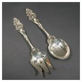 LOT 251 | PAIR REED & BARTON "LOVE DISARMED" SERVERS | Decorated salad servers, 1899, showing female