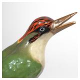 Each perched on a branch with an open beak, with underglaze blue double-sword marks h. 11 in.