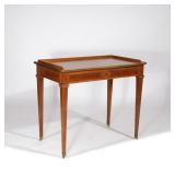 LOT 277 | CONTINENTAL LEATHER-TOP WRITING TABLE | 19th century, Neo-classical style with 3/4 gallery