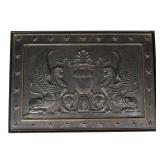 The fire back depicting an urn flanked by two sphinxes within a border of stars, having a thick plat