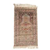 LOT 302 | HEREKE SILK & METALLIC THREAD PRAYER RUG | Early - mid 20th century, having a cream-colore
