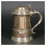 LOT |326 | GEORGE II SILVER TANKARD | With London hallmarks and 1740 date mark, having a hinged lid 