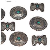 Leather belt with a sterling silver buckle adorned with six turquoise cabochons, having seven bow ti