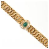 18k yellow gold link bracelet with a central cabochon emerald with halo of 16 diamonds; 7 in., 39.7g