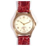 Weathered silver dial with Roman and baton numerals, sub-seconds dial, gold engraved case (dia. 29mm