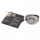Titanium case, blue dial with three chronograph subdials, date window, moon phase, outer tachymeter 