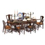 LOT 396 | MINIATURE DINING SET | Comprising a double pedestal extension dining table marked "Made in