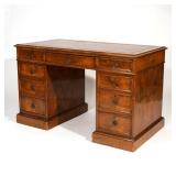 LOT 635 | ENGLISH WALNUT TWIN PEDESTAL DESK | 19th century, inset tooled red leather surface, three 