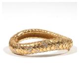 Lot 97  |  ANGELA CUMMINGS DIAMOND & 18K GOLD BRACELET  |  Of serpentine form with engraved scale pa
