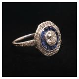  0.67ct European brilliant cut diamond (5.65 - 5.60 x 3.52mm) within concentric circles of sapphires